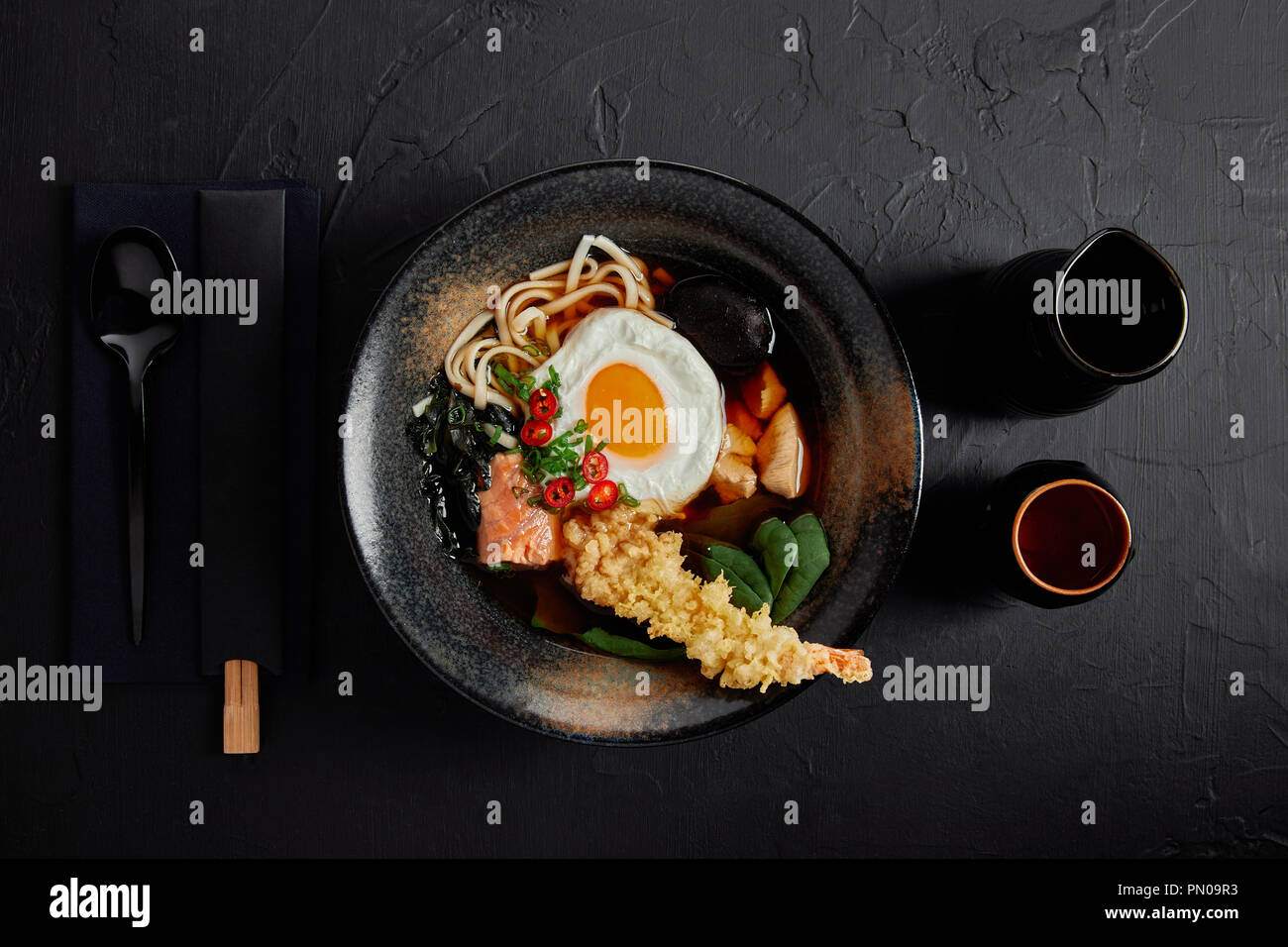 top view of bowl with gourmet japanese soup with egg, noodles and