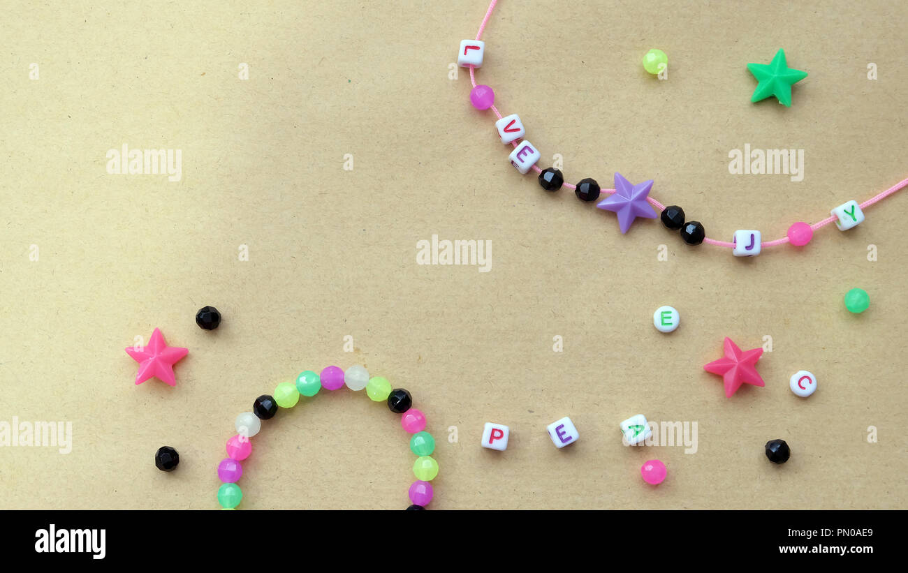 Flat lay of bead pieces, bracelet and necklace for kids Stock Photo