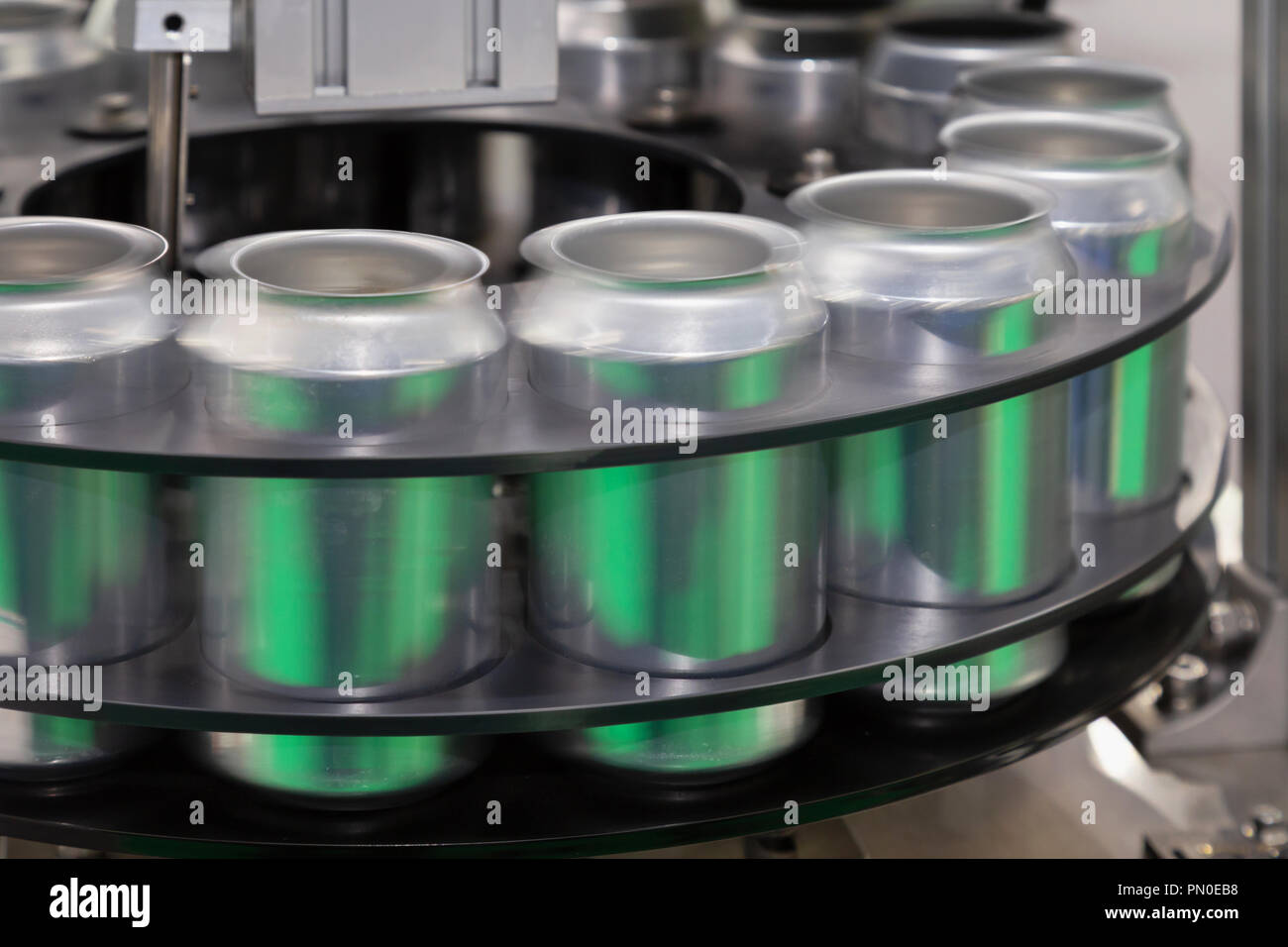 empty new aluminum cans for drink process are moving in factory line on conveyor belt machine at beverage manufacturing. food and beverage industrial  Stock Photo