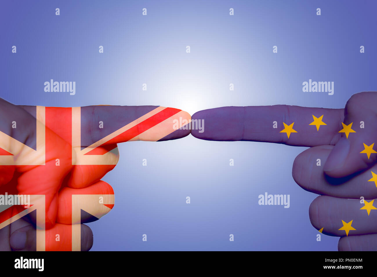 Two different hands touching each other by index finger, Brexit concept Stock Photo