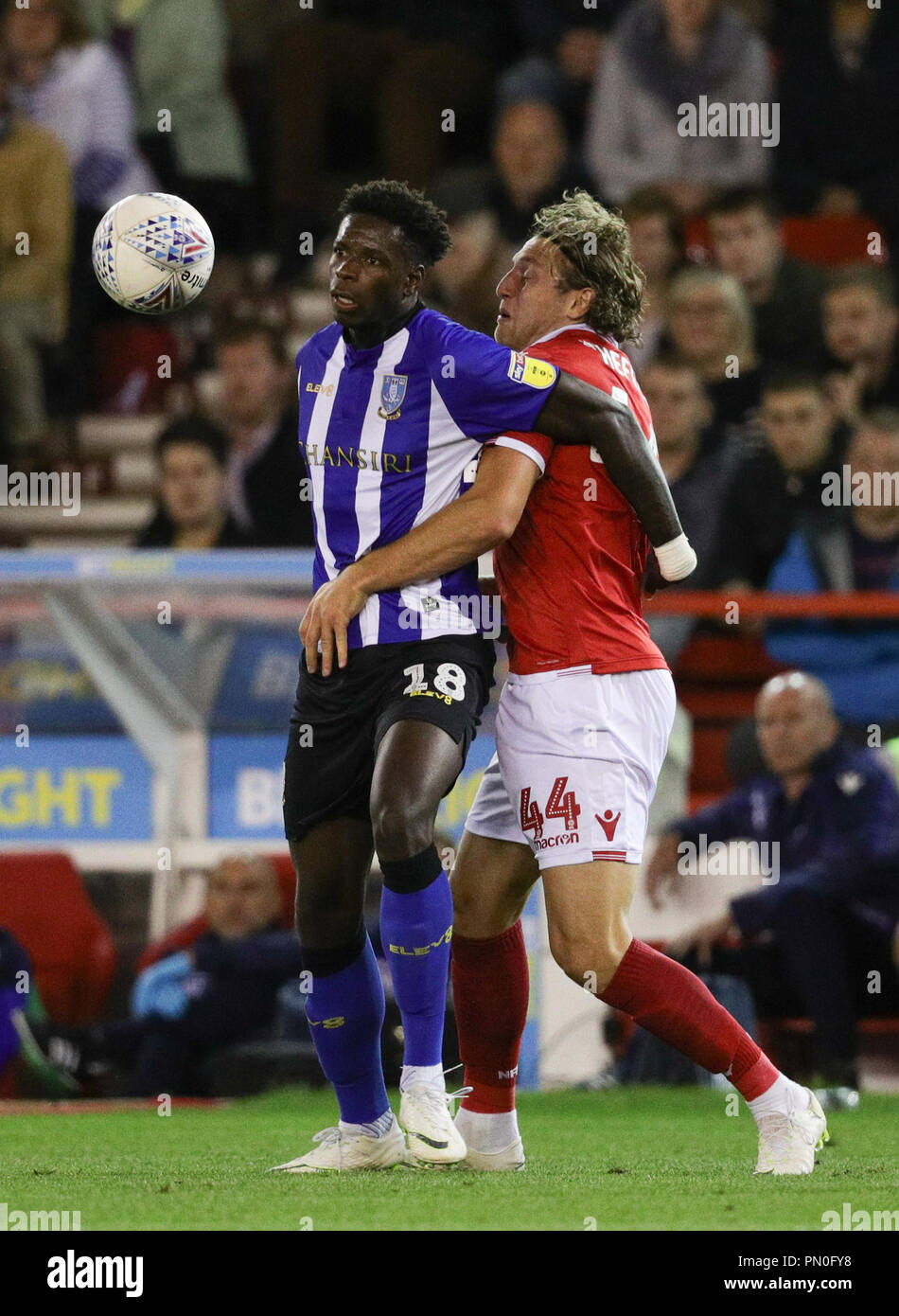 Sheffield Wednesday's Lucas Joao (left) and Nottingham Forest's Michael Hefele battle for the ball during the Sky Bet Championship match at the City Ground, Nottingham. Stock Photo