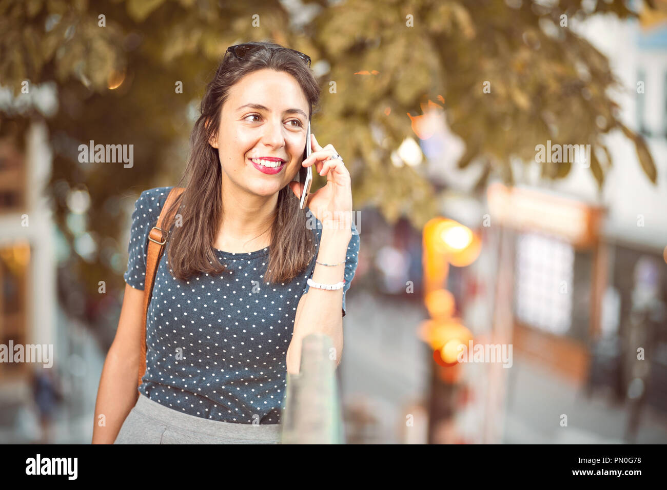 Young, natural woman calling on a cell phone Stock Photo