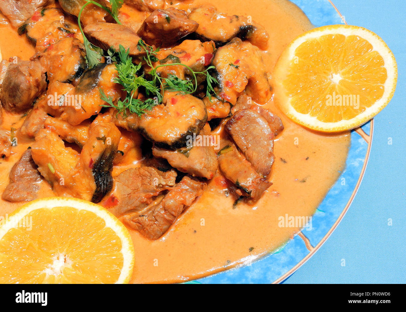 Eels with pork meat (Enguias com carne de porco), Sarilhos Grandes. Montijo, Portugal Stock Photo