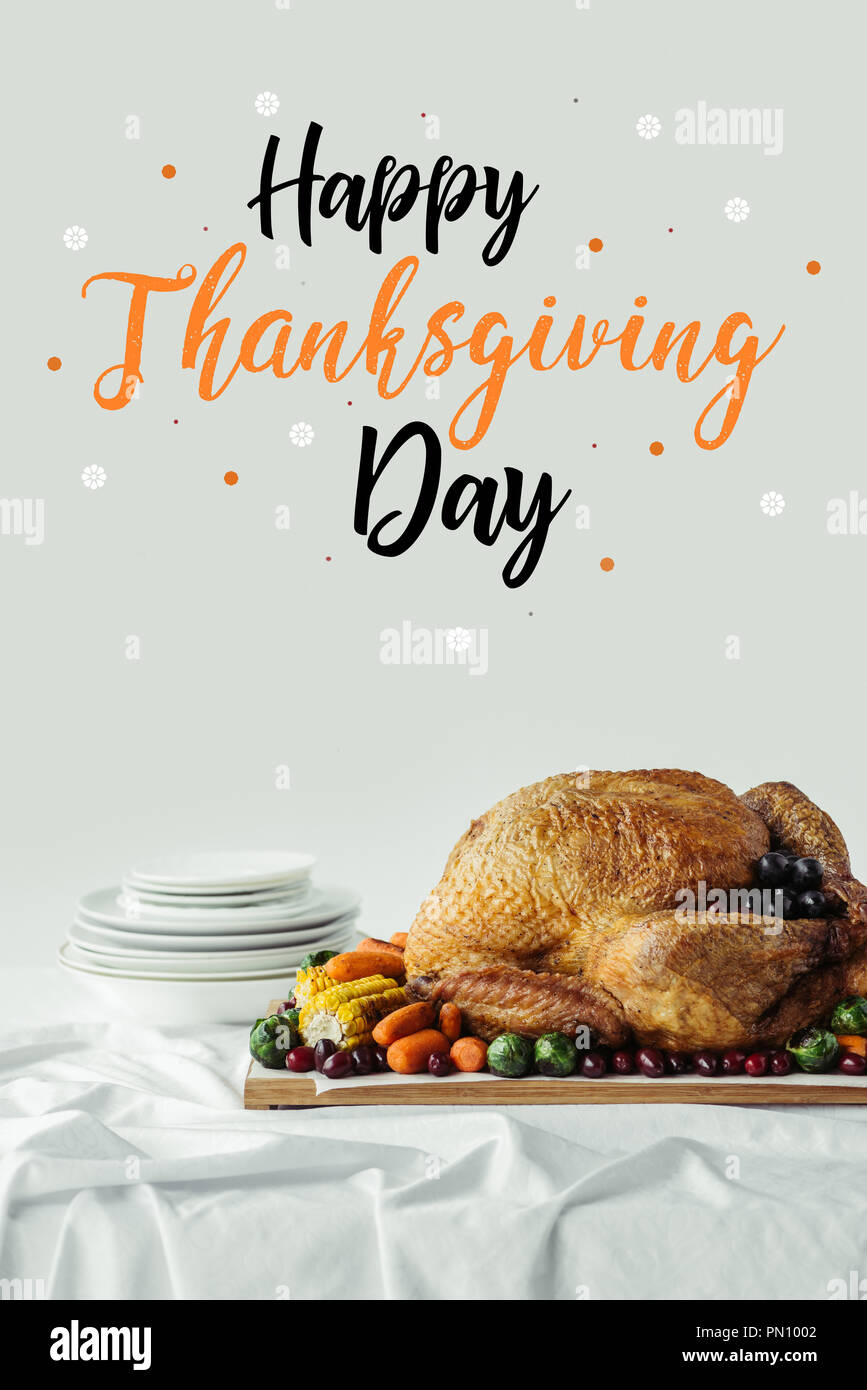 Close Up View Of Roasted Turkey Cutlery And Happy Thanksgiving Day Lettering On Grey Background Stock Photo Alamy