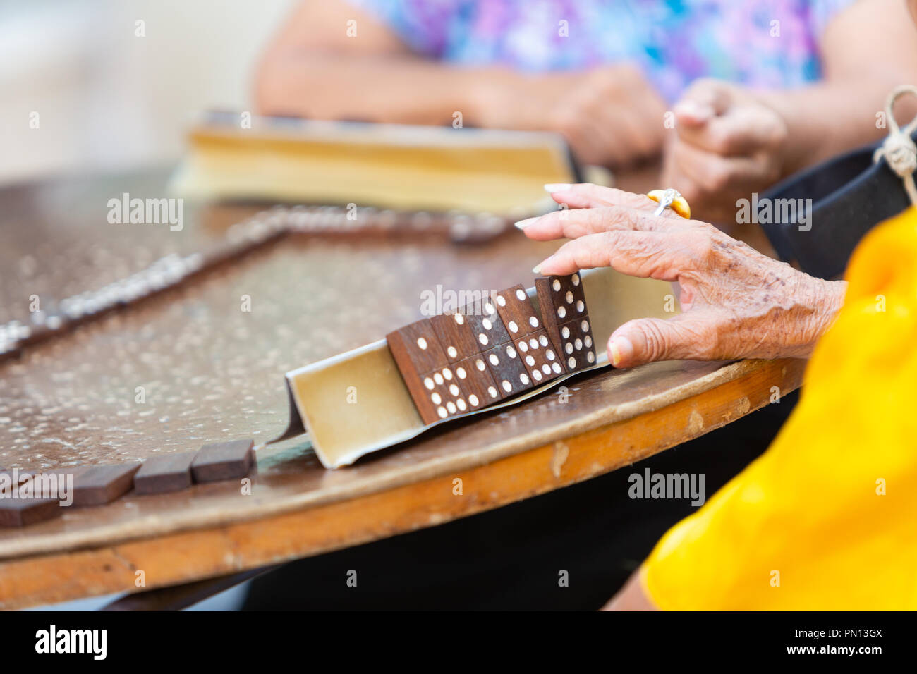 Senior Cuban women playing dominoes on the street in Havana, Cuba Stock Photo