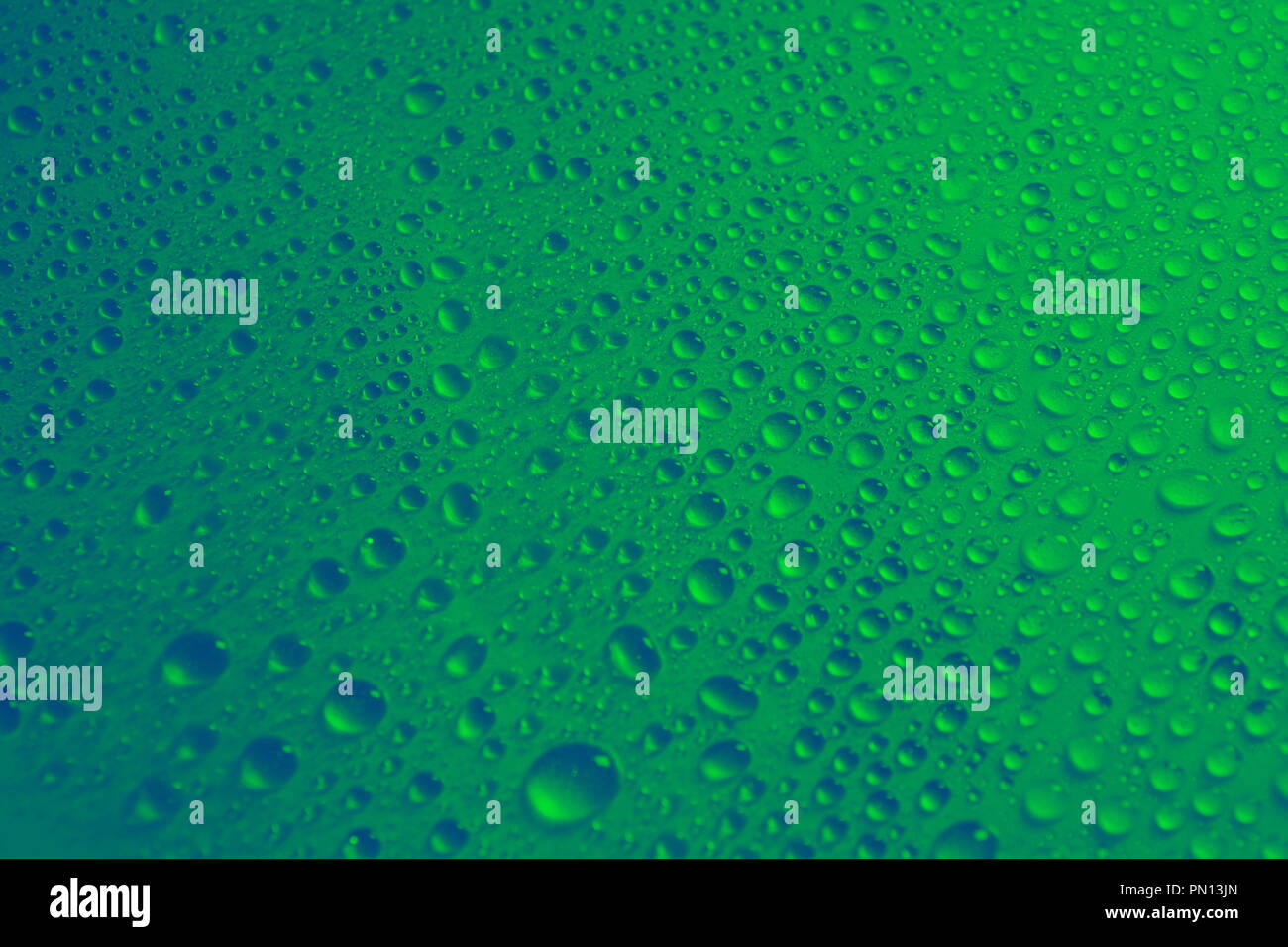 water drops green background texture close-up Stock Photo - Alamy