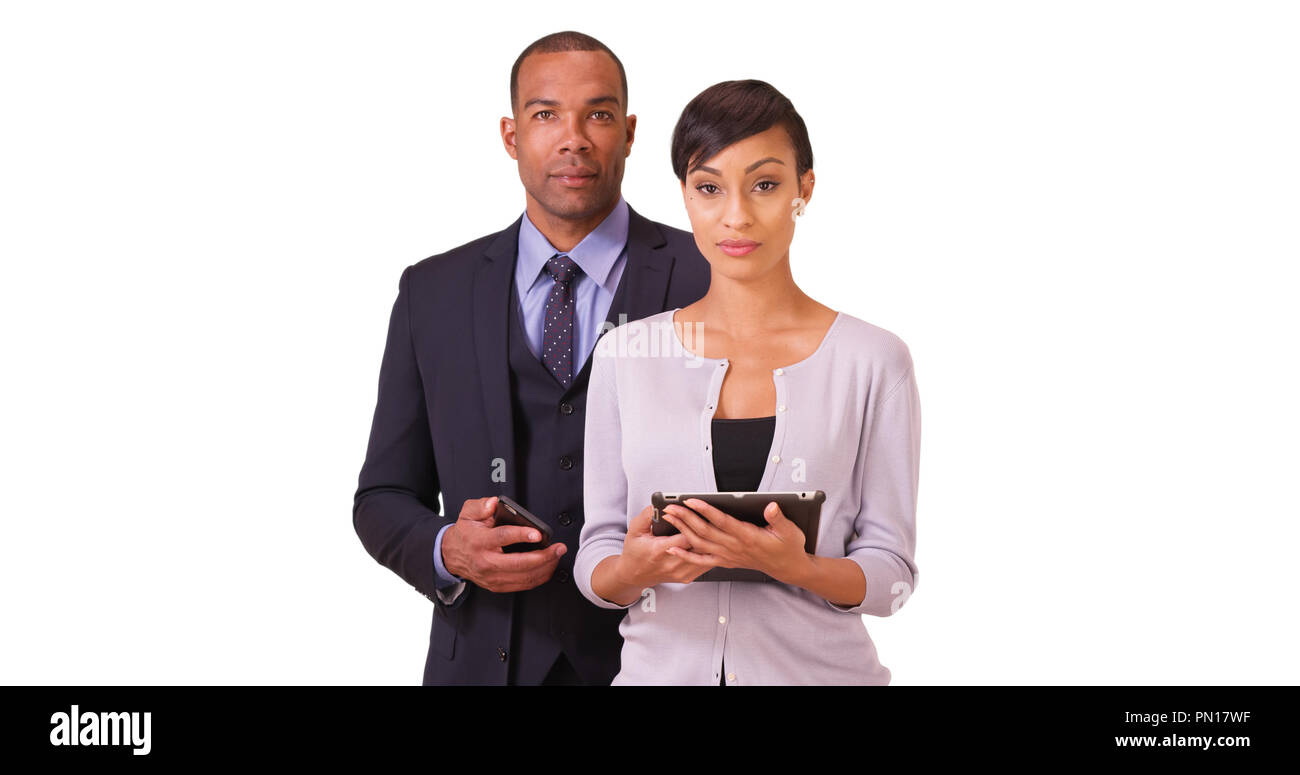 African American couple pose for a portrait ion a white background ...