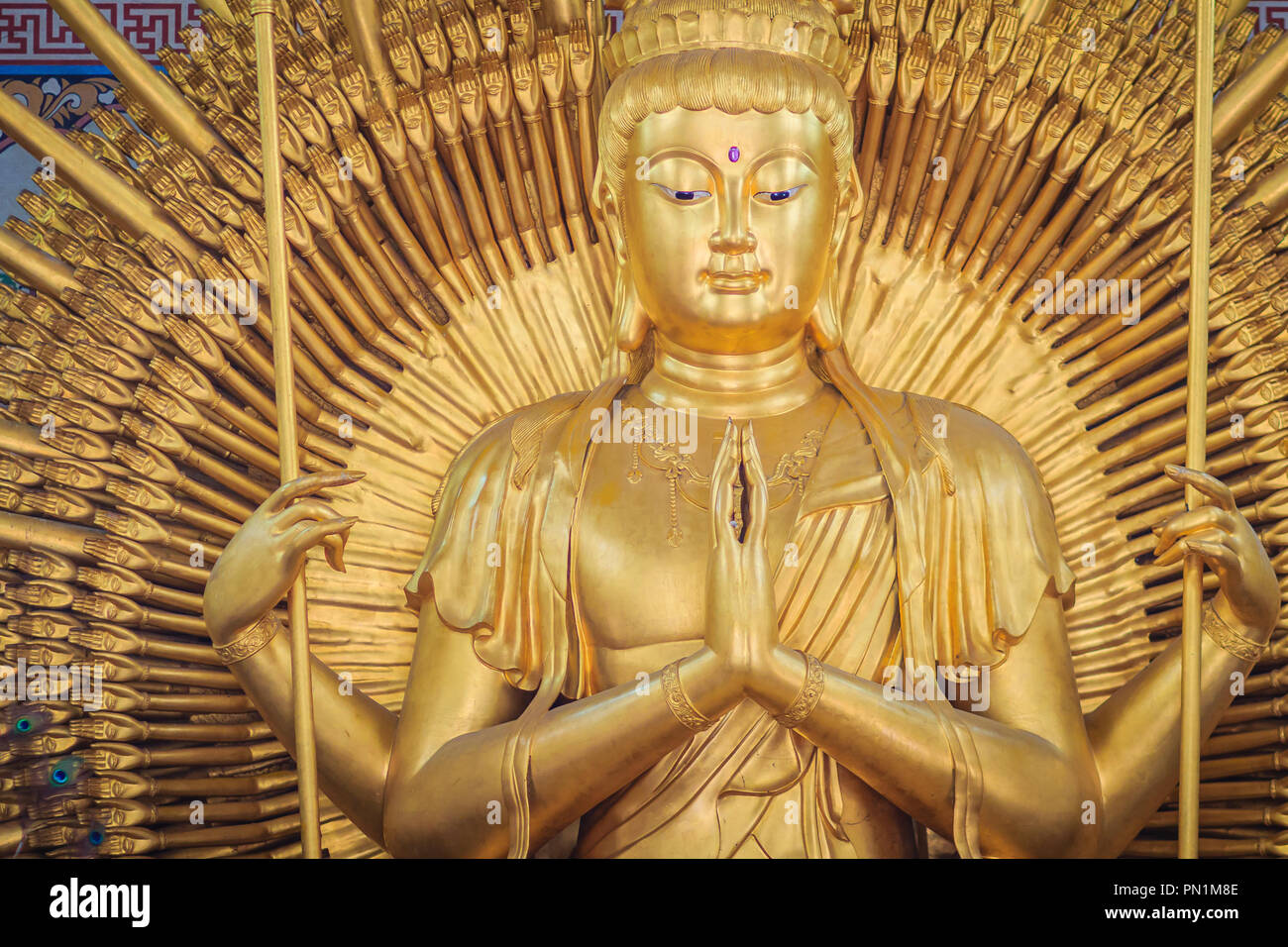 Golden statue of Guan Yin with 1000 hands. Guanyin or Guan Yin is an