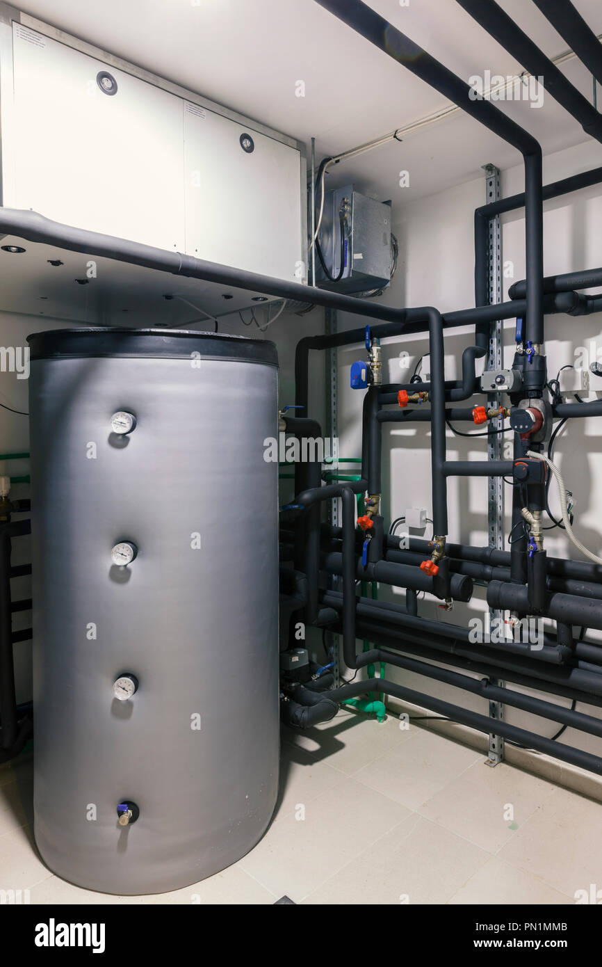 Home heating installations with boilers and pipes Stock Photo Alamy