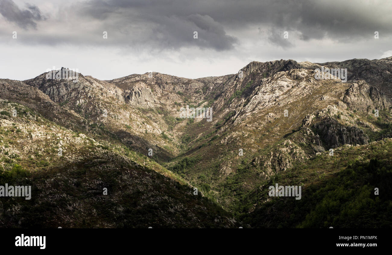 Panorama of the rocky mountains on a stormy day. Stock Photo