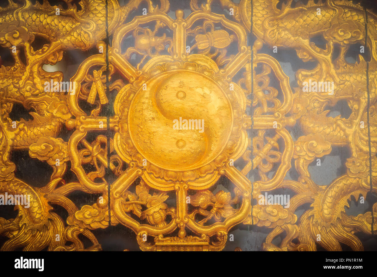 Golden symbol of Yin - Yang on the wall of Chinese temple in Thailand ...