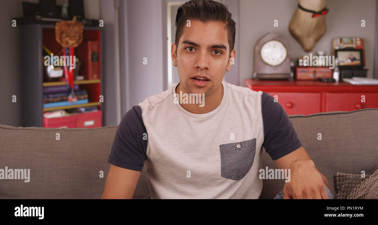 Young millennial Hispanic man talking to camera Stock Photo