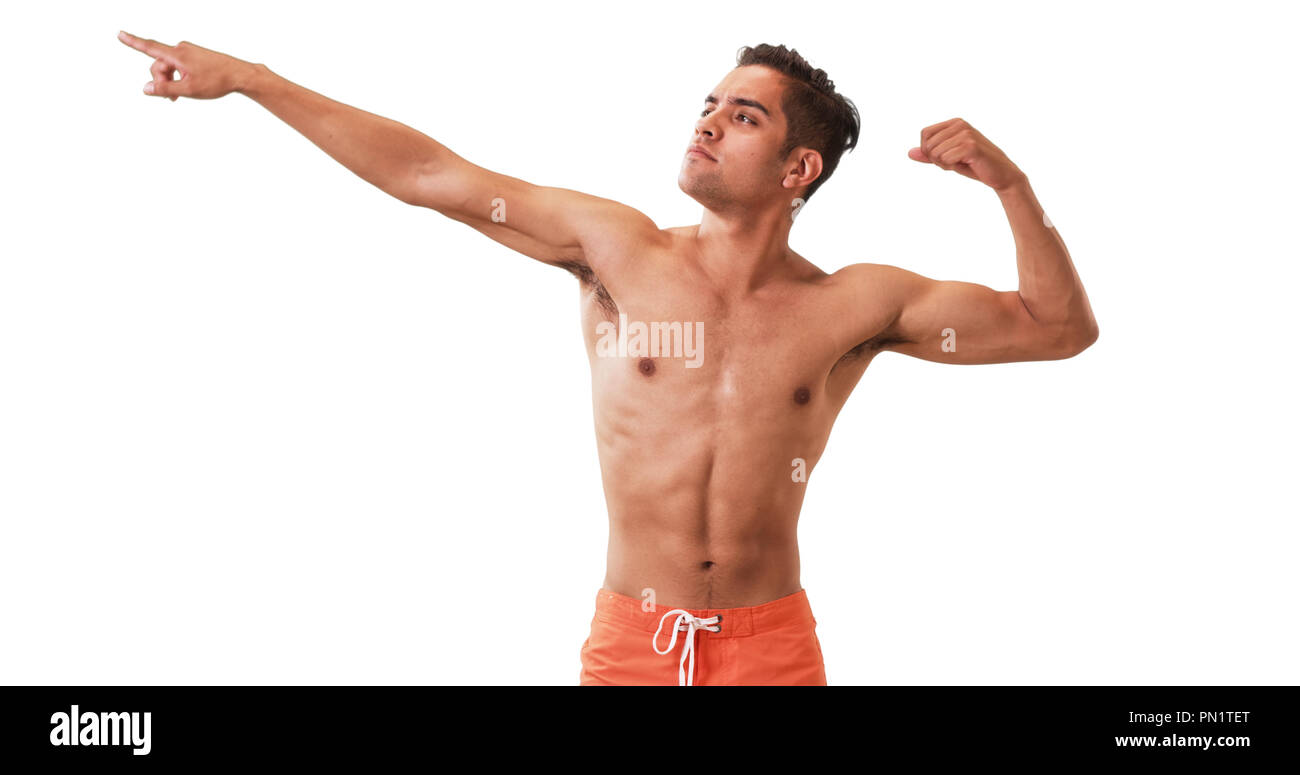 Happy Millennial Hispanic man posing in swim trunks on white background ...