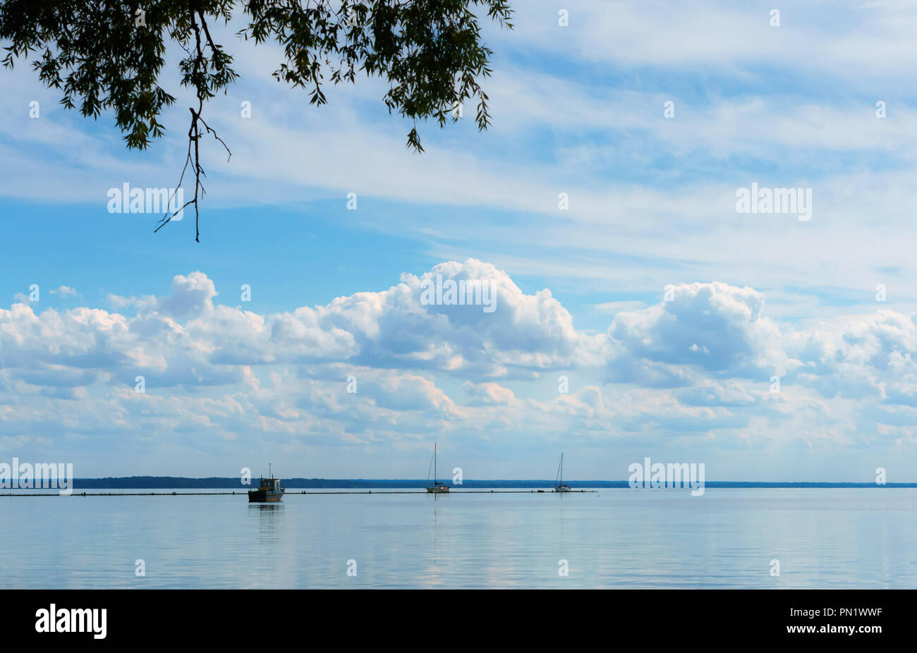 the sea calm, the fishing boats on the horizon Stock Photo