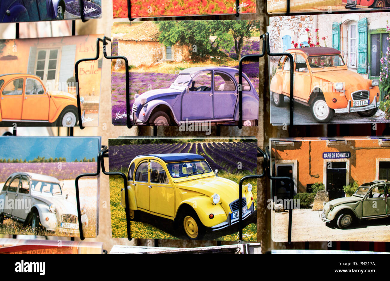 Card Shop with 2CV's in The Village of Roussillon Provence France Stock Photo
