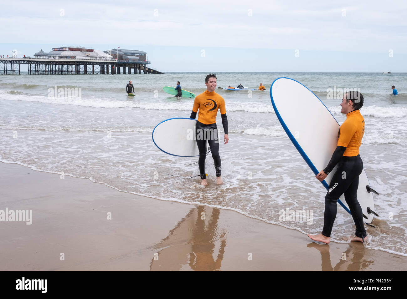 Surfing class on Cromer Beach, Norfolk UK Stock Photo
