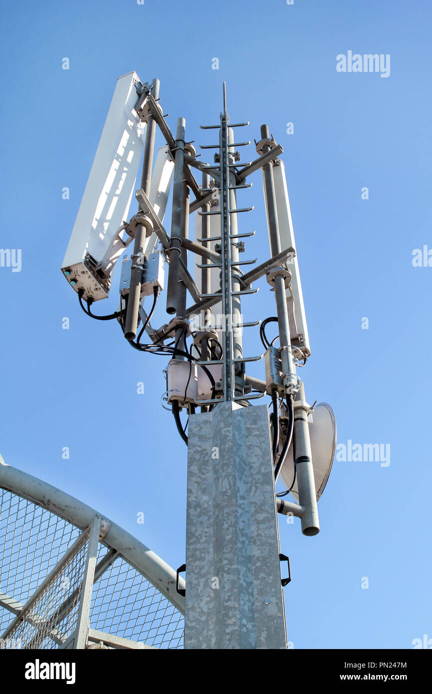 Telecommunication network repeaters. Antenna tower and repeater of  communication and telecommunication. Communications tower Stock Photo -  Alamy