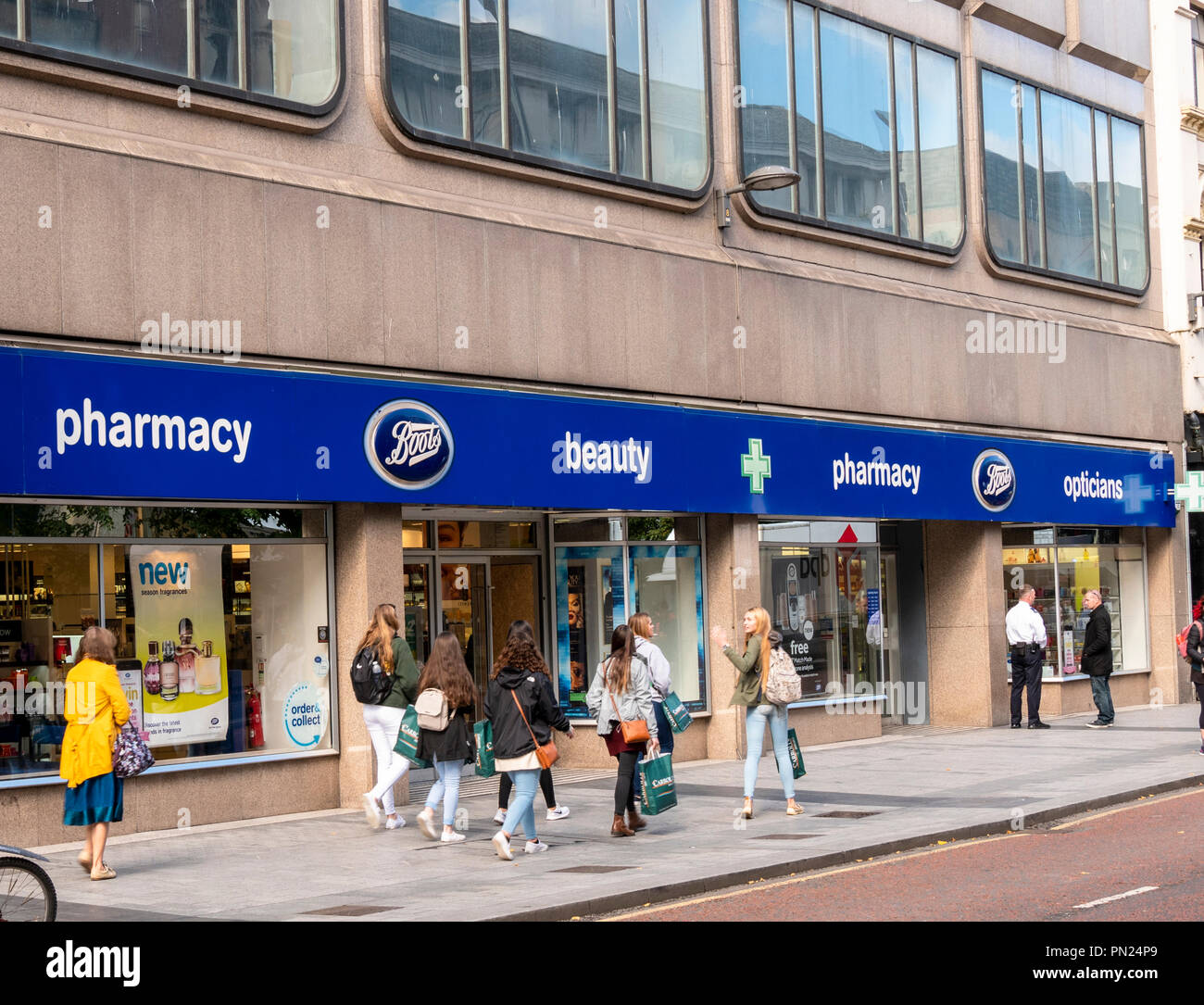 Boots Chemist, Donegall Place, Belfast. Young women walking past Stock  Photo - Alamy