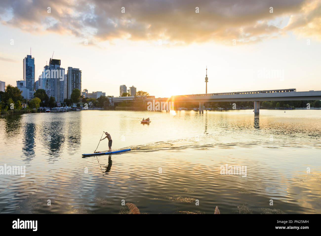 Wien, Vienna sunset at lake Alte Donau (Old Danube), skyscraper of