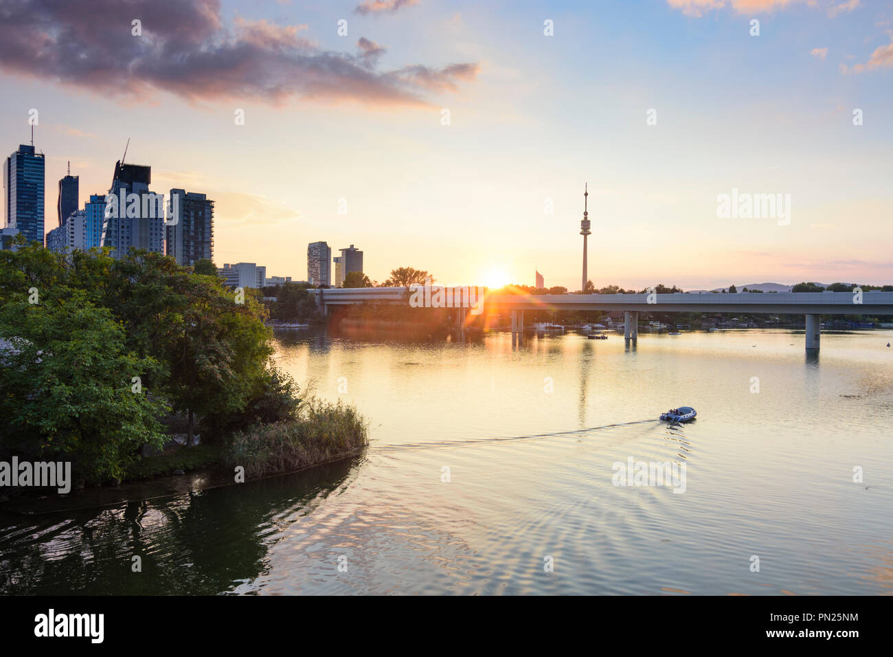 Wien, Vienna sunset at lake Alte Donau (Old Danube), skyscraper of