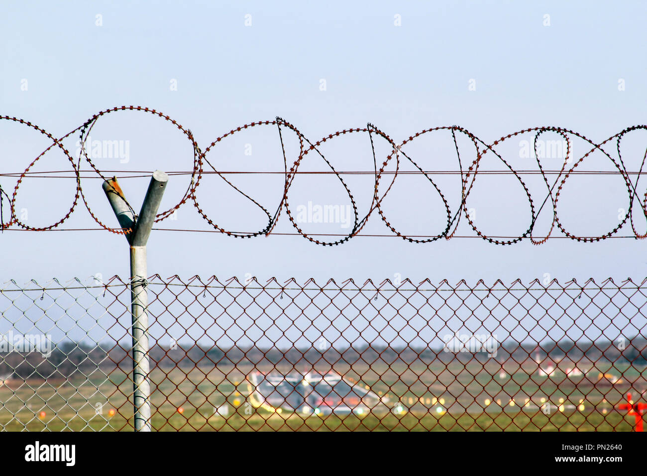 Security Fence. Protective wire barbed fence at the airport. A