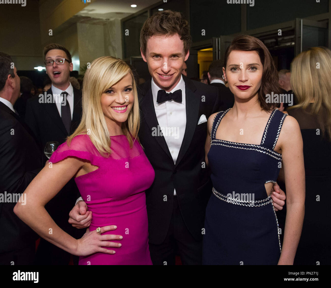 Reese Witherspoon (left), Eddie Redmayne (center) and Felicity Jones  attend the 6th Annual Governors Awards in The Ray Dolby Ballroom at Hollywood & Highland Center® in Hollywood, CA, on Saturday, November 8, 2014.  File Reference # 32487 024THA  For Editorial Use Only -  All Rights Reserved Stock Photo