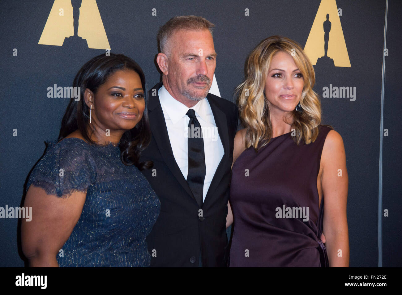 Octavia Spencer (left), Kevin Costner (center) and Christine Baumgartner attend the 6th Annual Governors Awards in The Ray Dolby Ballroom at Hollywood & Highland Center® in Hollywood, CA, on Saturday, November 8, 2014.  File Reference # 32487 036THA  For Editorial Use Only -  All Rights Reserved Stock Photo