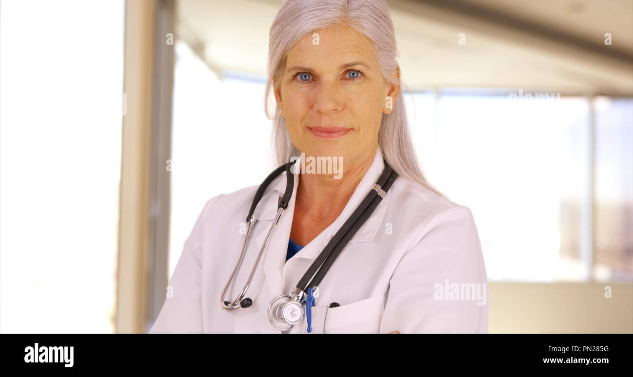 Confident female doctor poses hi-res stock photography and images - Alamy