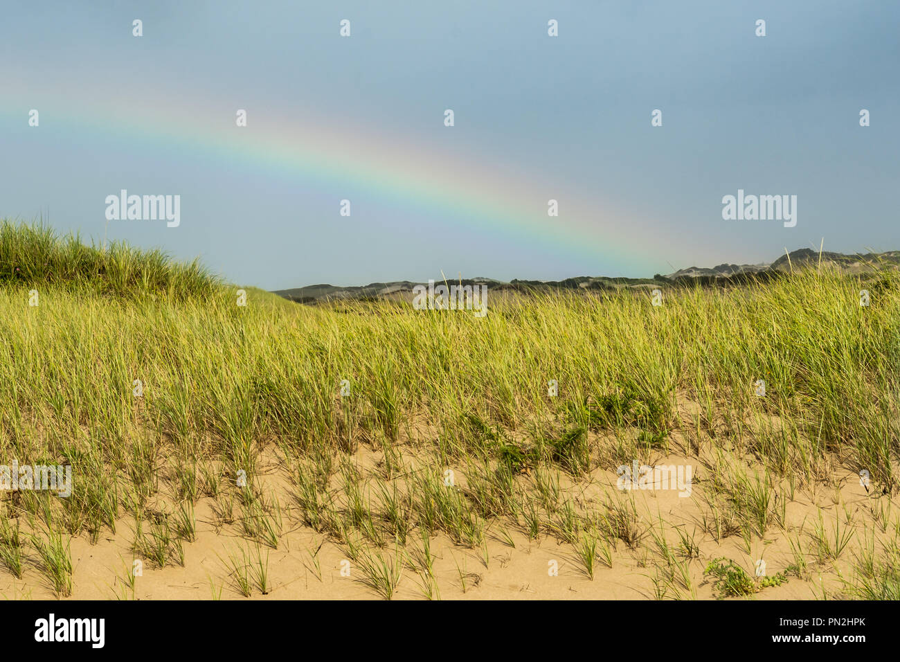 Rainbow over a beach in Cape Cod Massachusetts Stock Photo Alamy
