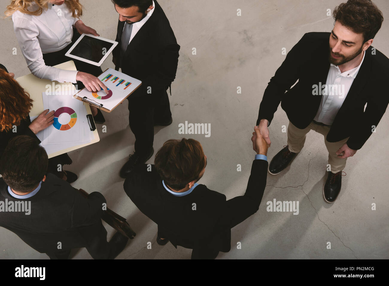 Handshaking business person in office. concept of teamwork and partnership Stock Photo