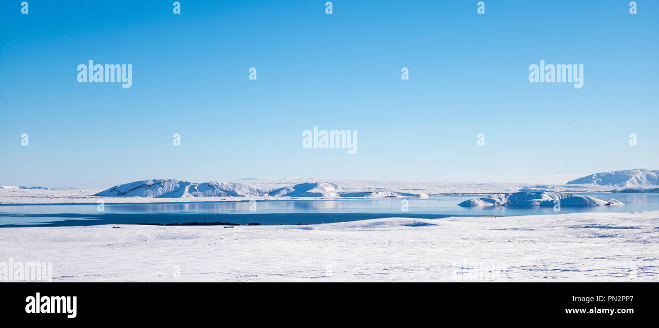 Snow-covered mountains and lake in stunning glacial landscape in South Iceland Stock Photo
