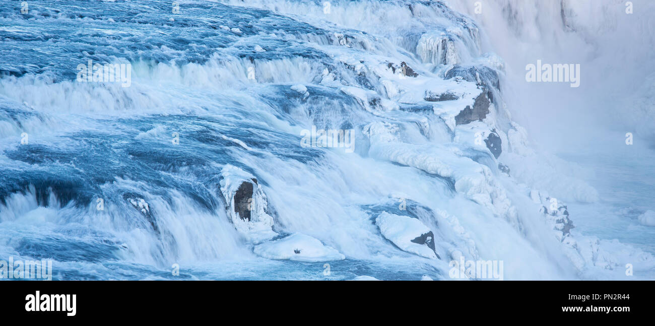 Gushing, flowing water glacial river at thundering falls of Gullfoss Waterfall in South Iceland Stock Photo