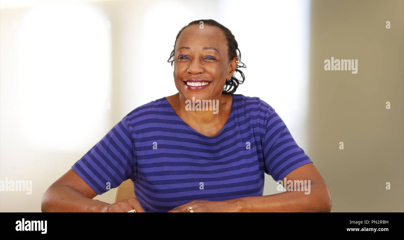 An elderly black woman smiling at the camera Stock Photo