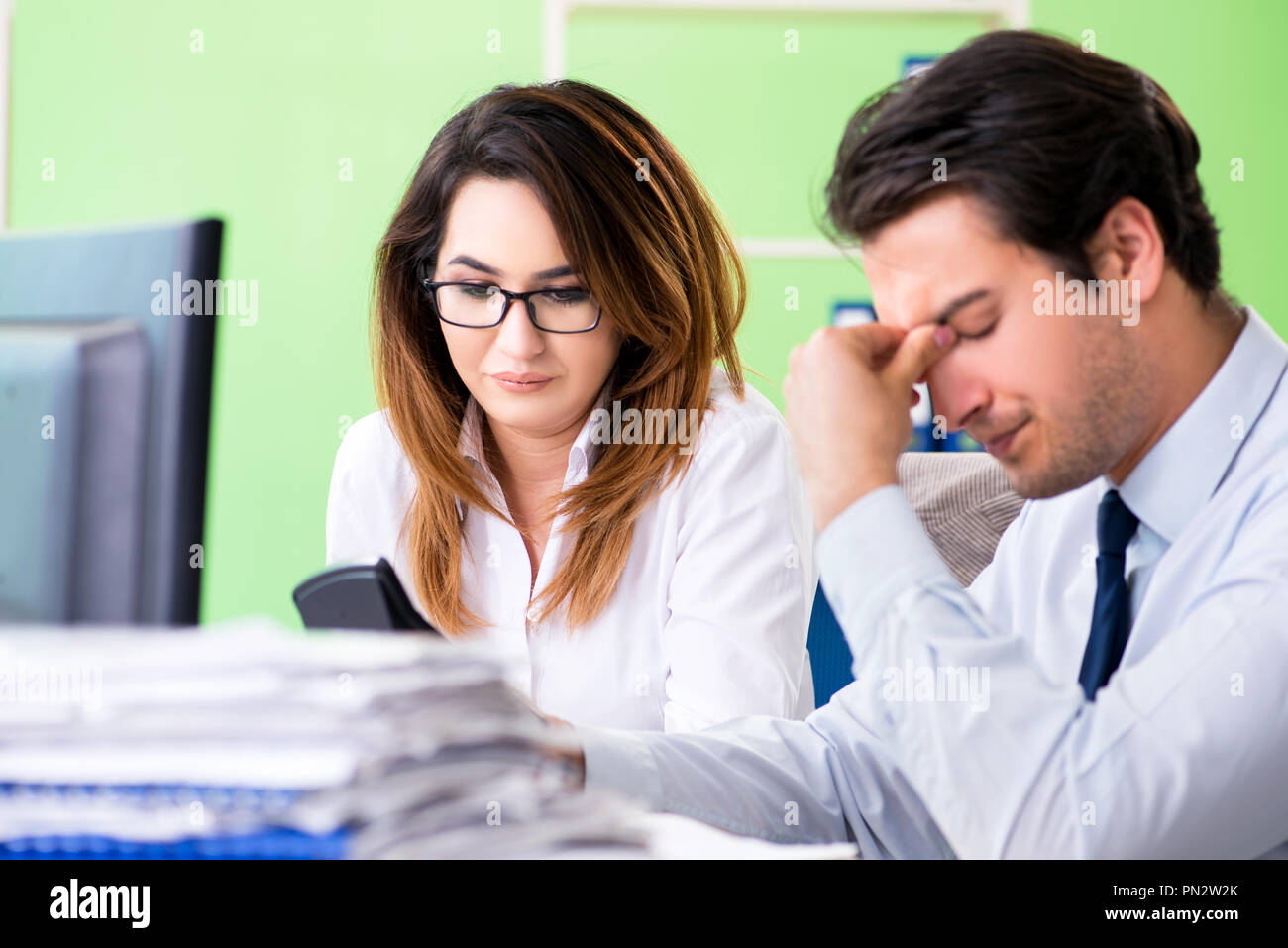 Two financial specialists working in the office Stock Photo - Alamy
