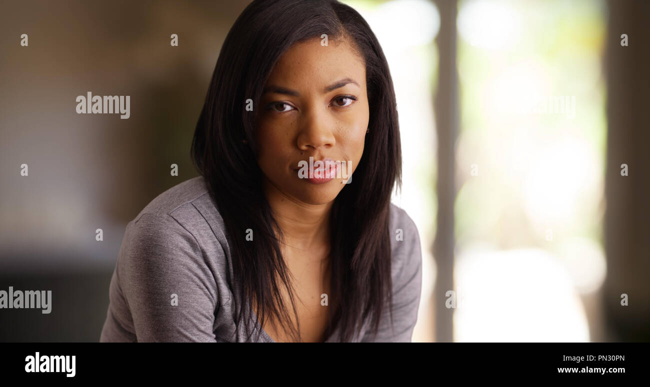 Portrait Of Beautiful African Woman With Straight Hair Looking At