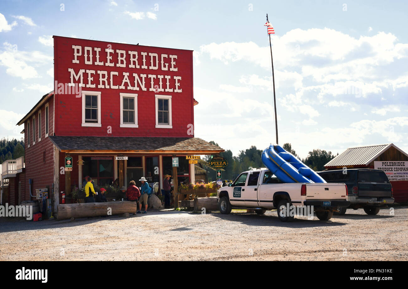 POLEBRIDGE, MONTANA, USA - September 9, 2018: Tourists gather on the front porch of the historical landmark Polebridge Mercantile Stock Photo
