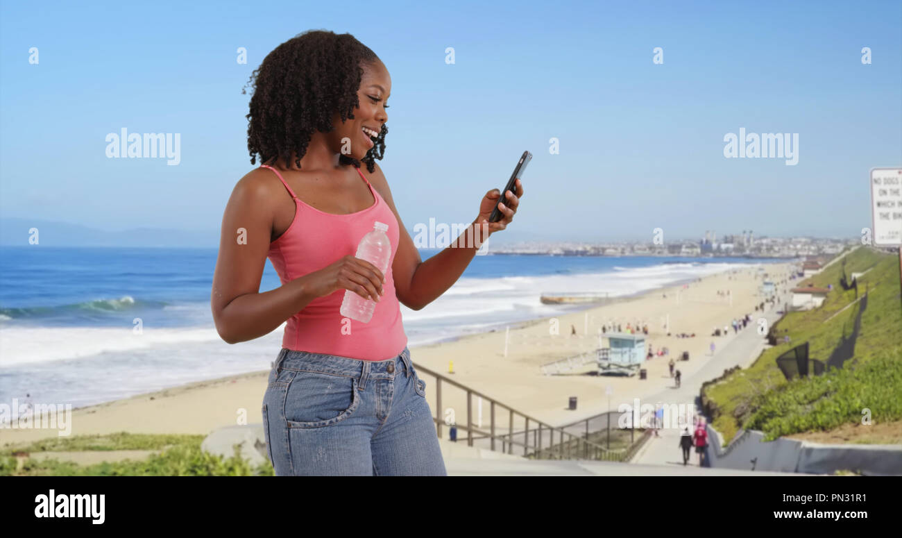 Woman dancing beach jeans hi-res stock photography and images - Alamy