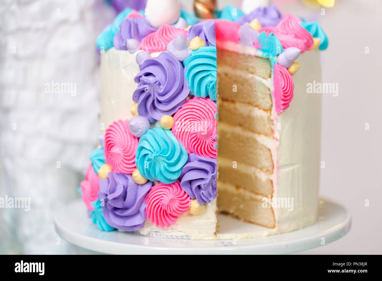 Sliced Multilayer Unicorn Cake On Cake Stand At The Little Girl Birthday Party Stock Photo Alamy