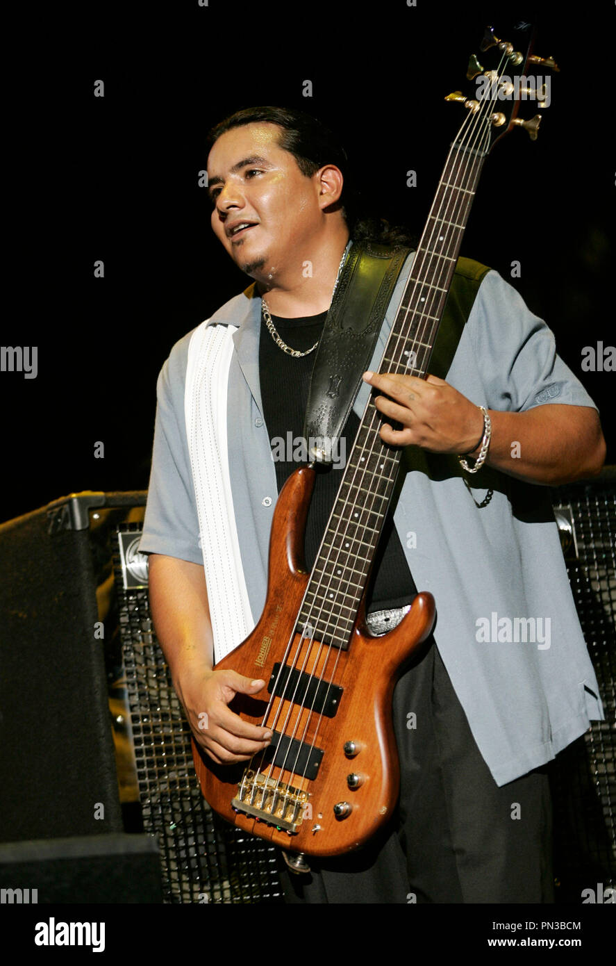 JoJo, bass guitar player for the Grammy Award winning Rock-N-Roll trio Los  Lonely Boys, grimaces as he plays during a music concert featuring the  Texas based band, at Contingency Operating Base Speicher