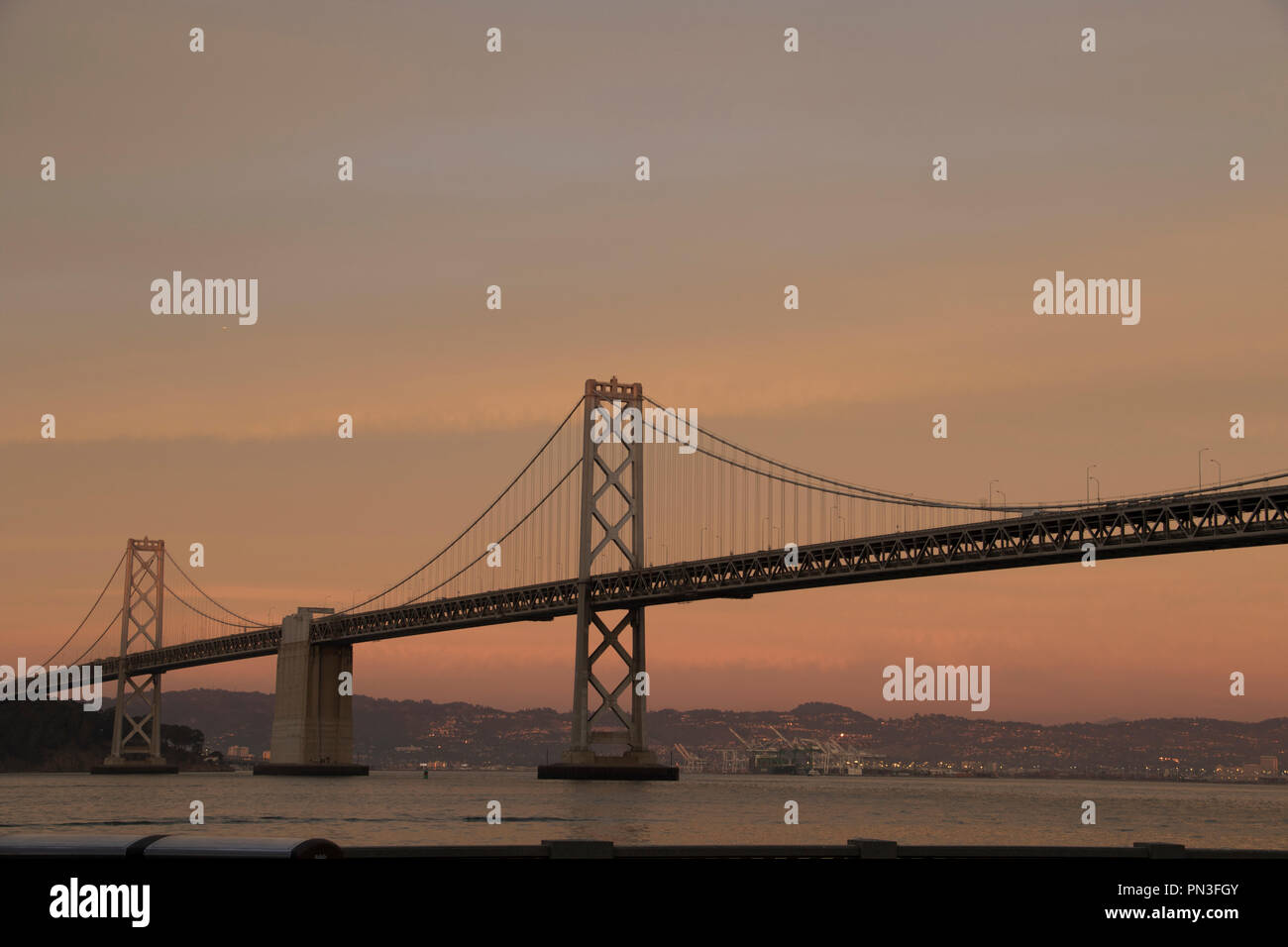 Suspension bridge at sunset in San Francisco. Stock Photo