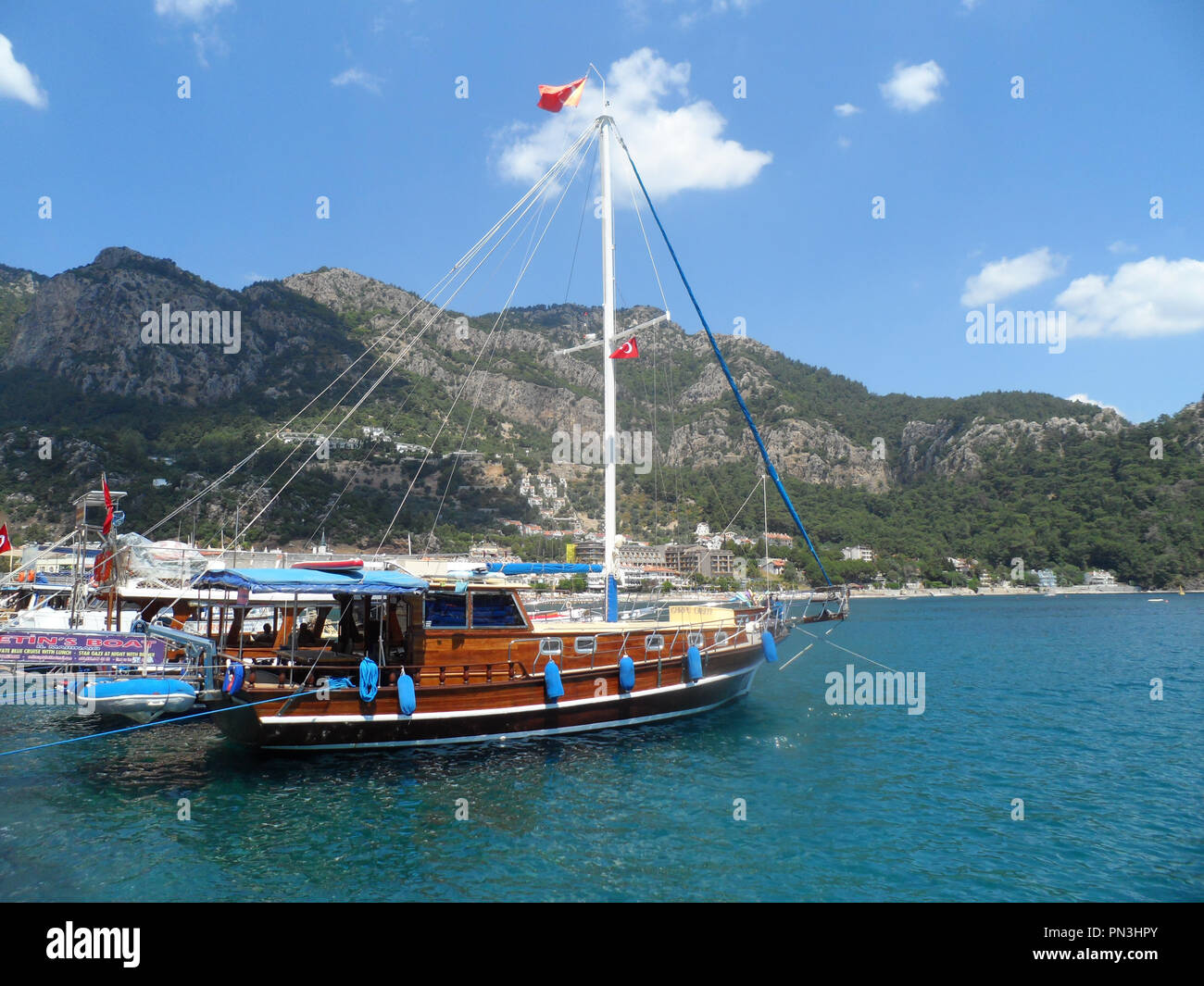 Turkish gulet cruise boat moored alongside the harbour at Turunc, Mugla province, Turkey Stock Photo