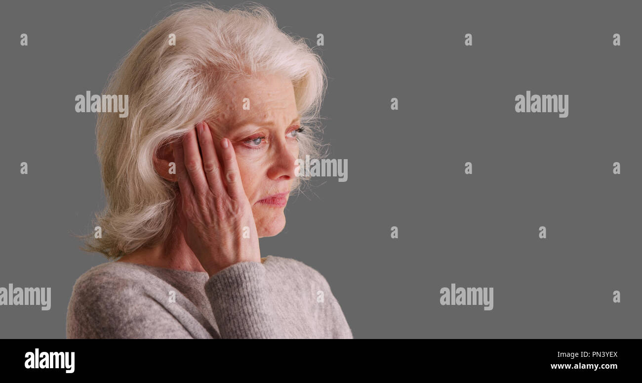 One woman rubbing temples hi-res stock photography and images - Alamy