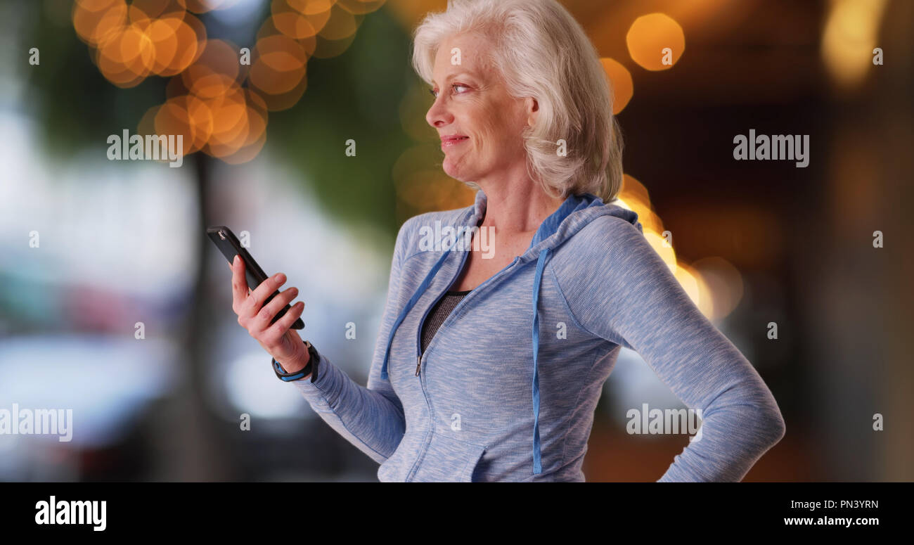 Elderly woman in hoodie holding hi-res stock photography and images - Alamy