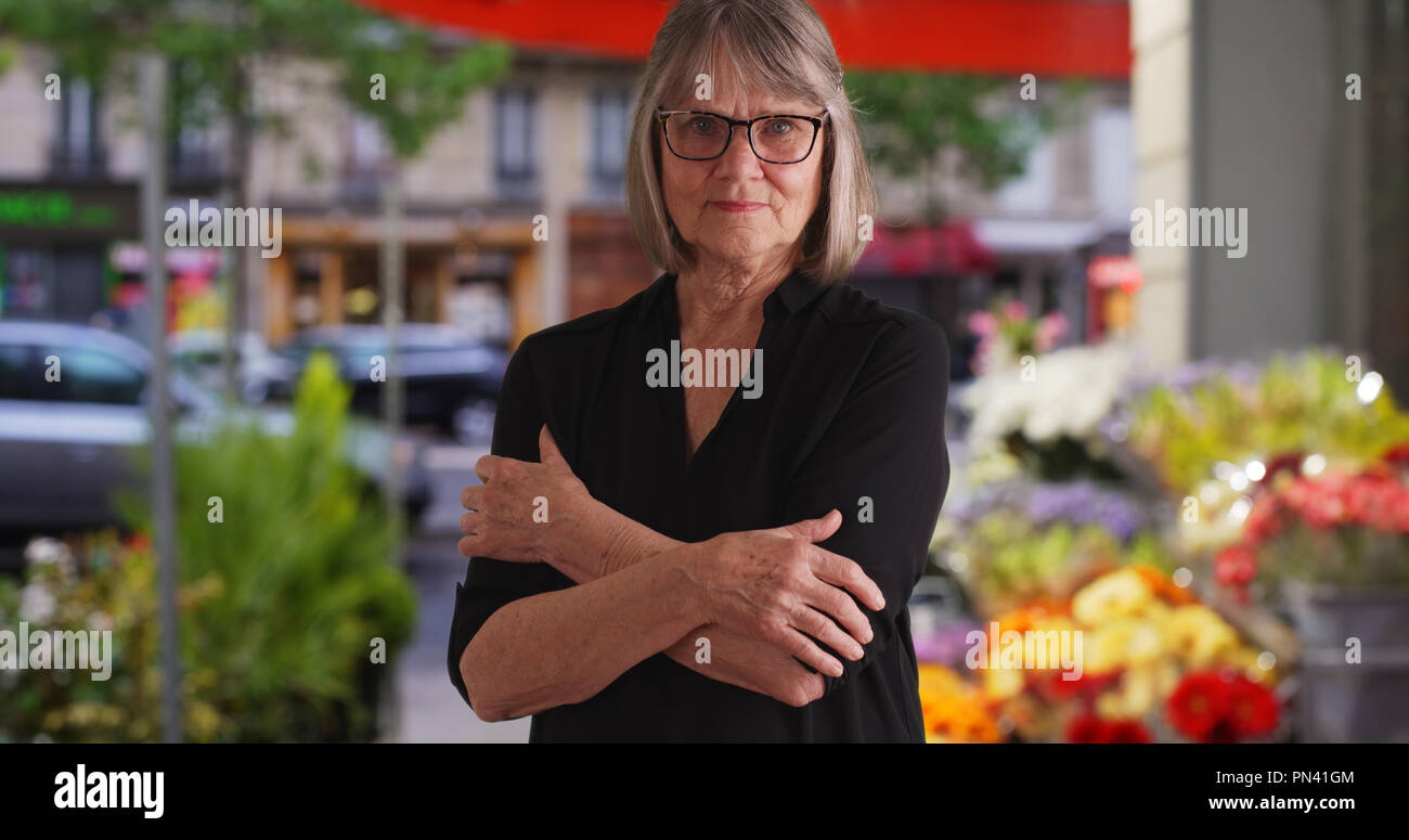 Stern looking woman arms crossed hi-res stock photography and images ...