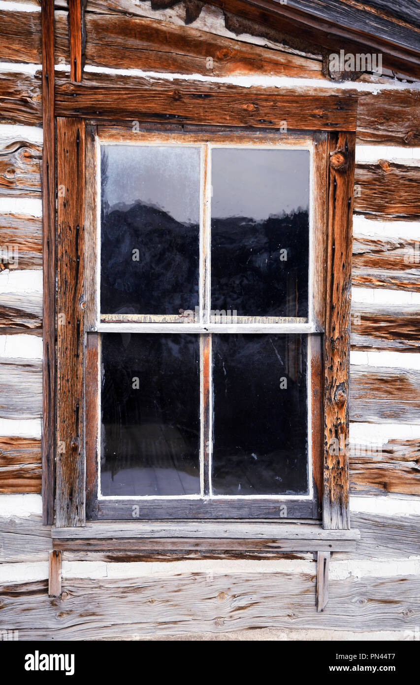 Window in an old rustic log cabin Stock Photo