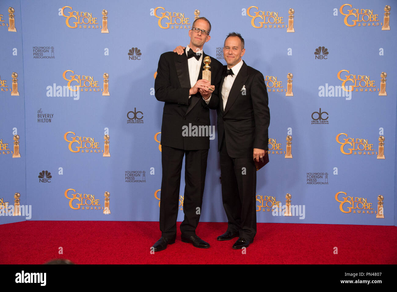 For BEST ANIMATED FEATURE FILM, the Golden Globe is awarded to 'The Peanuts Movie,' directed by Steve Martino. Pete Docter and Jonas Rivera pose with the award backstage in the press room at the 73rd Annual Golden Globe Awards at the Beverly Hilton in Beverly Hills, CA on Sunday, January 10, 2016. Stock Photo