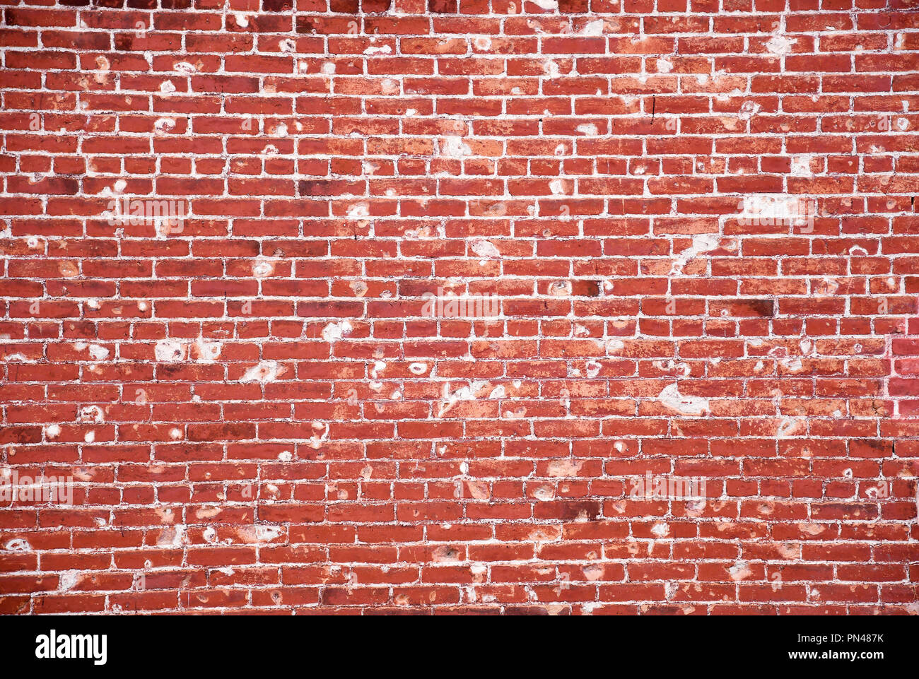 Old brick wall with numerous patches Stock Photo