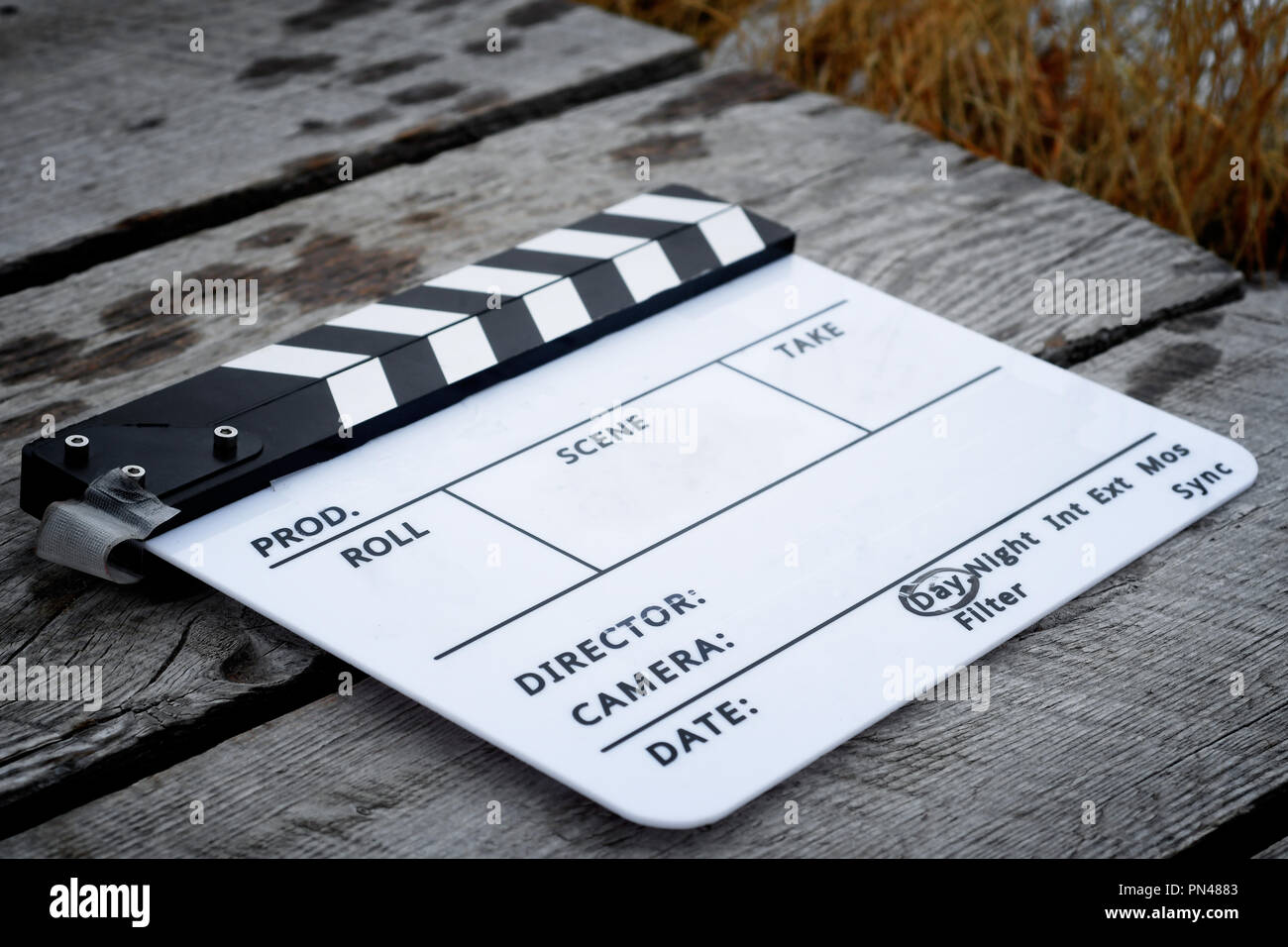 Directors clapboard on a wooden walkway on a movie set Stock Photo