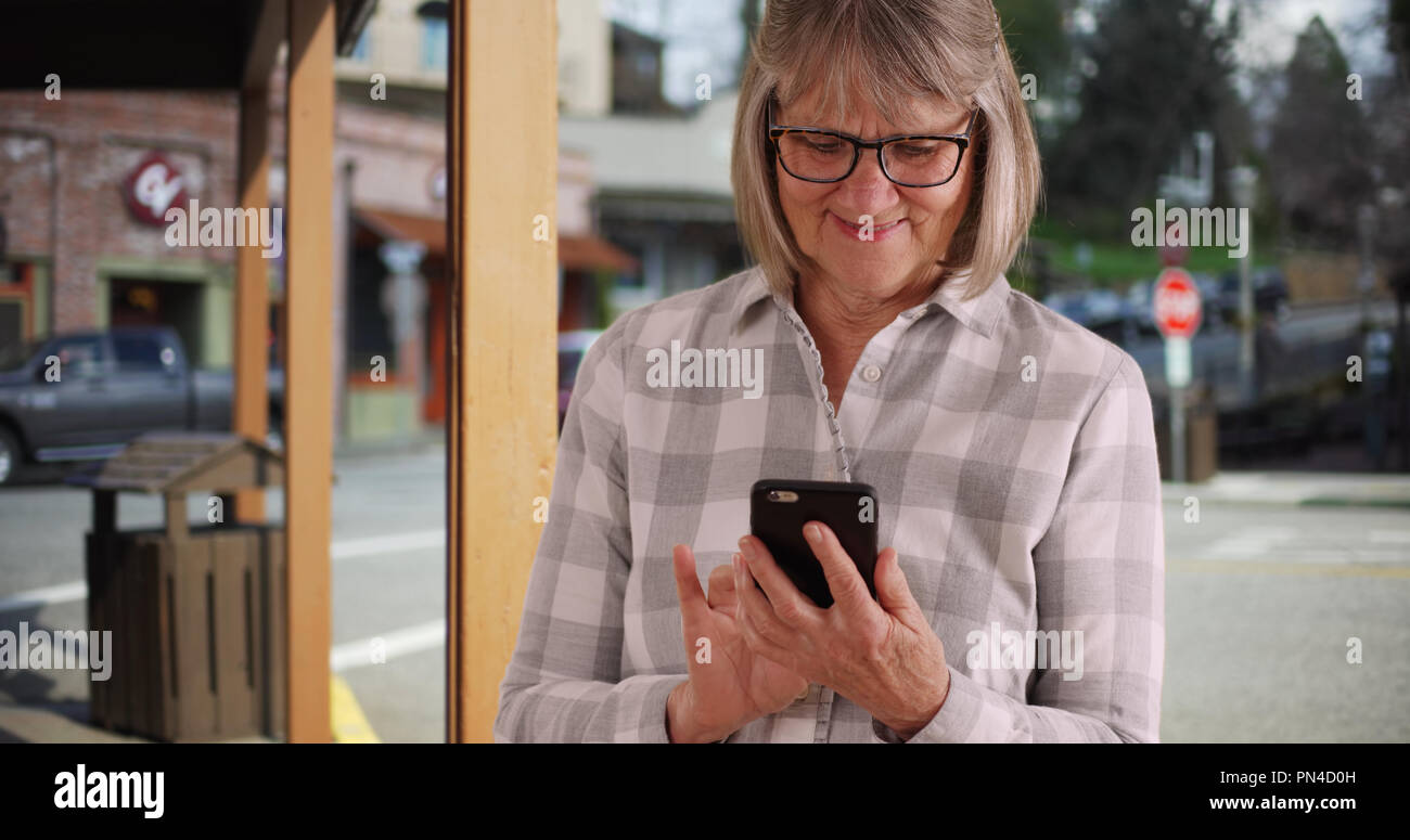 Mature lady standing on street hi-res stock photography and images - Alamy