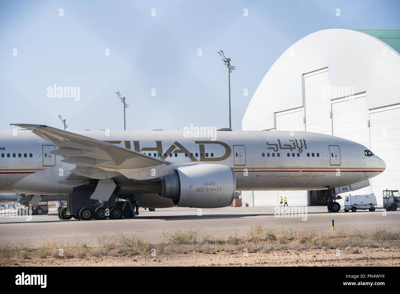 An Etihad airline boeing 777 aircraft seen parked at Teruel airport. Many people think Teruel airportis an aircraft graveyard where aircrafts go through their final journey and have their metal recycled. In fact this airport located in eastern Spain is more like a hotel for aircrafts to take a long nap.  It hosts aircraft from all over the world that have been withdrawn from service, be it temporarily or permanently, and caters to their maintenance needs. Some are ready to fly but are waiting for financial or legal issues to be sorted out. Some are here because their airlines need to temporari Stock Photo